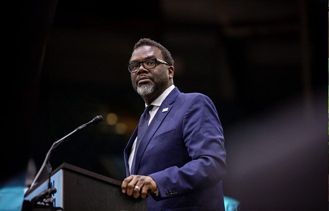 Chicago Mayor Brandon Johnson speaks at a podium.