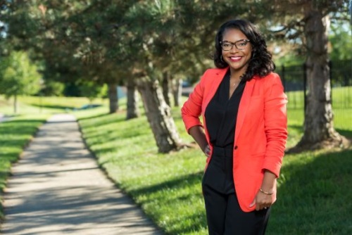 Portrait of Representative Emilia Sykes standing outside.