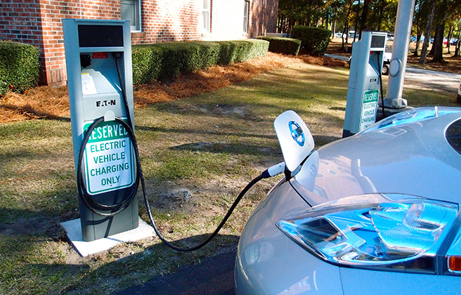 Electric vehicle plugged into a charging station in Myrtle Beach, SC.