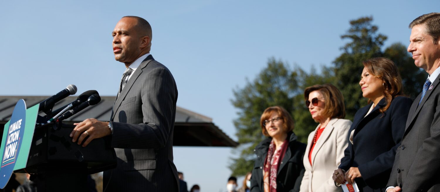 House Minority leader Hakeem Jeffries speaks at a podium during a Climate Action Now Press Event, standing in front of fellow lawmakers