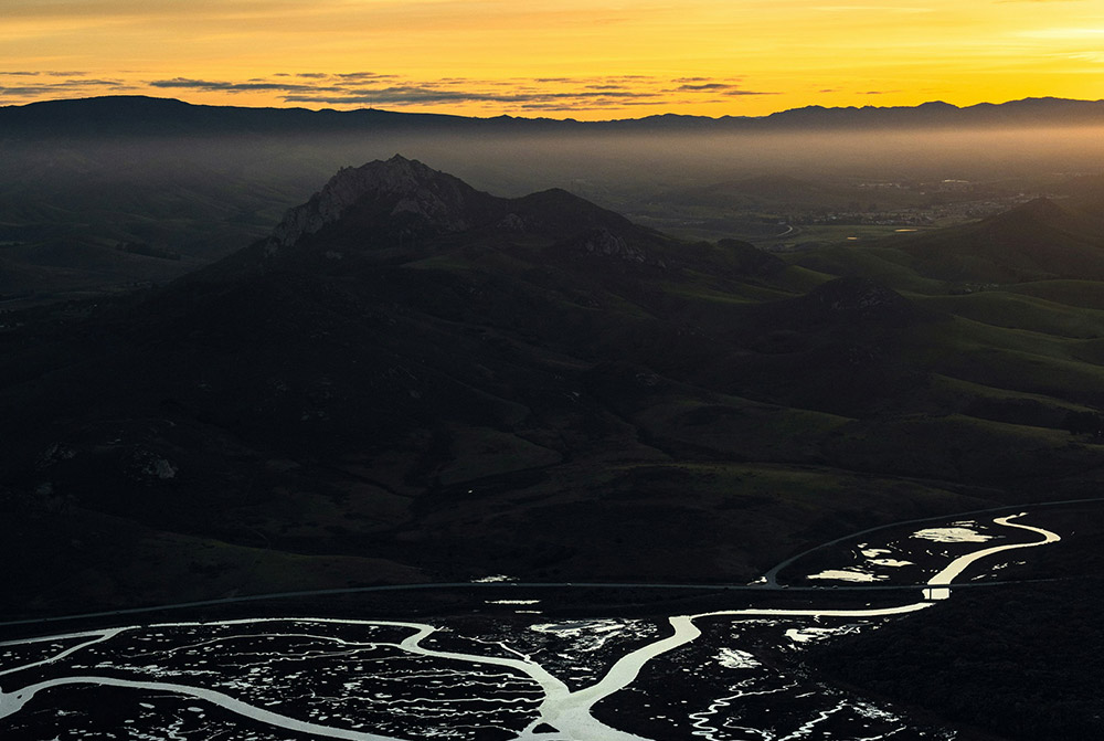 The sun setting over a mountain rain near San Luis Obispo, CA.