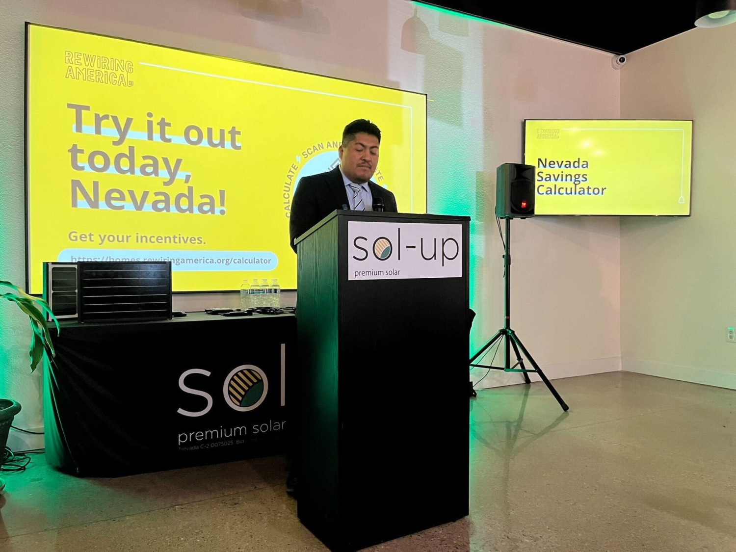 Yonathan speaking at a lectern