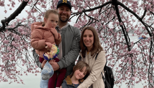 Bentley and family in front front of a tree